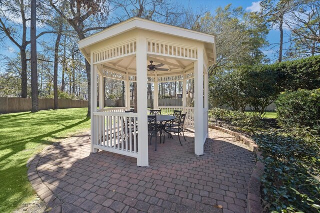 2203 Long Valley Dr, Kingwood, TX 77345 - view of patio featuring a ceiling fan, a gazebo, and outdoor dining space