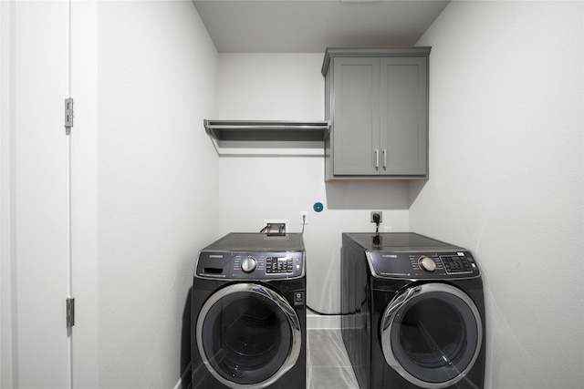 1682 Sherwood Glen Dr, Friendswood, TX 77546 - laundry area featuring separate washer and dryer and cabinet space