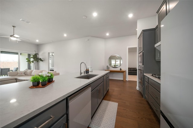 1682 Sherwood Glen Dr, Friendswood, TX 77546 - kitchen featuring a sink, appliances with stainless steel finishes, gray cabinetry, open floor plan, and recessed lighting