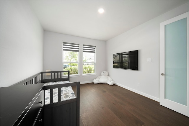 1682 Sherwood Glen Dr, Friendswood, TX 77546 - unfurnished bedroom featuring dark wood-style flooring, baseboards, and recessed lighting