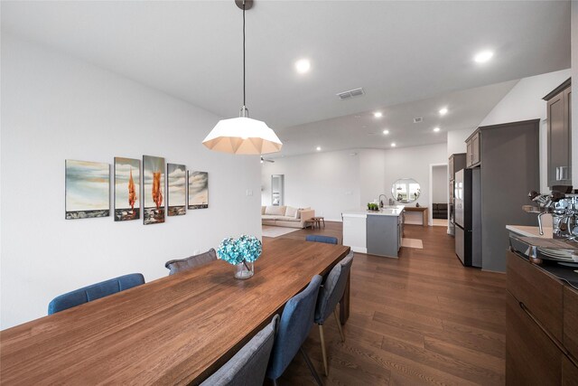 1682 Sherwood Glen Dr, Friendswood, TX 77546 - dining space featuring dark wood-type flooring and recessed lighting