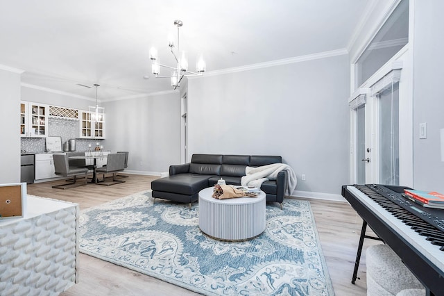 300 St Joseph Pkwy Unit 121, Houston, TX 77002 - living room with a chandelier, light wood-type flooring, ornamental molding, and baseboards