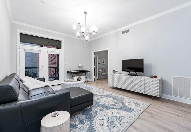 300 St Joseph Pkwy Unit 121, Houston, TX 77002 - living room featuring a chandelier, ornamental molding, french doors, wood finished floors, and baseboards