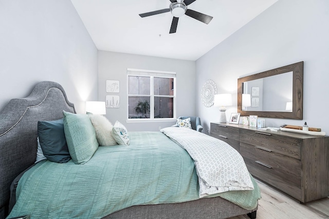 300 St Joseph Pkwy Unit 121, Houston, TX 77002 - bedroom with light wood-style flooring, ceiling fan, and vaulted ceiling