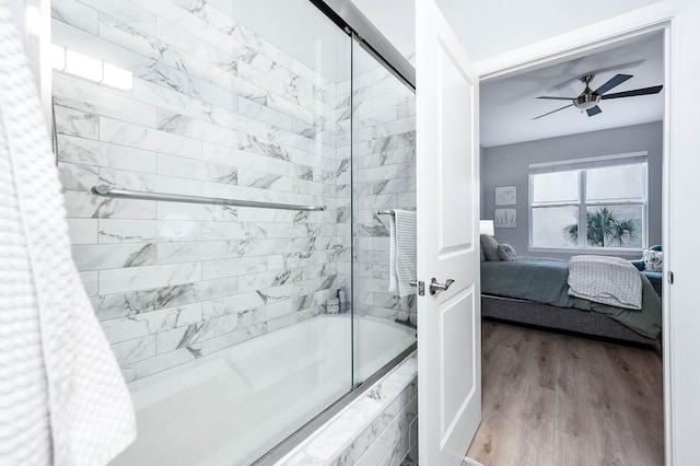 300 St Joseph Pkwy Unit 121, Houston, TX 77002 - full bathroom with ensuite bathroom, tiled shower / bath combo, wood finished floors, and ceiling fan