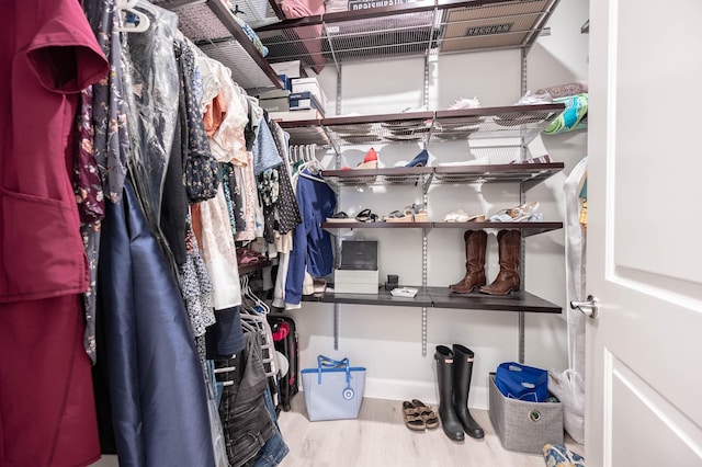 300 St Joseph Pkwy Unit 121, Houston, TX 77002 - spacious closet with wood finished floors
