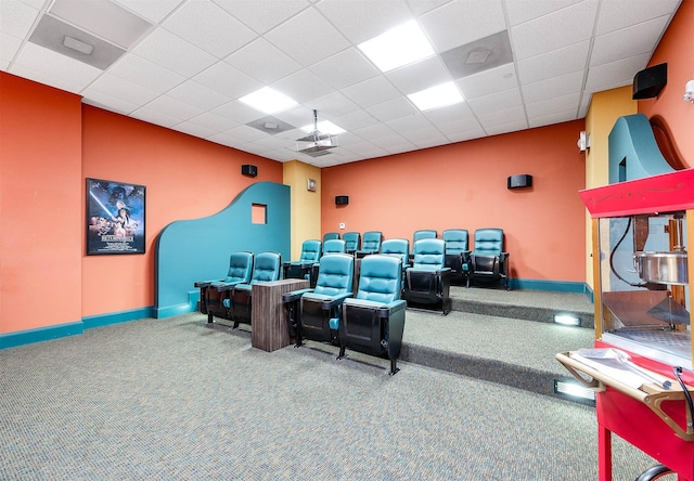 300 St Joseph Pkwy Unit 121, Houston, TX 77002 - cinema room featuring carpet flooring, baseboards, and a paneled ceiling