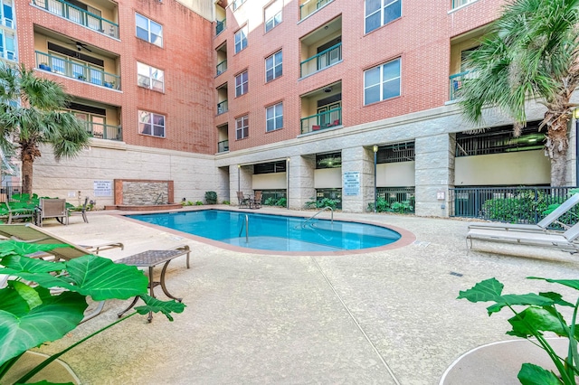300 St Joseph Pkwy Unit 121, Houston, TX 77002 - community pool featuring a patio