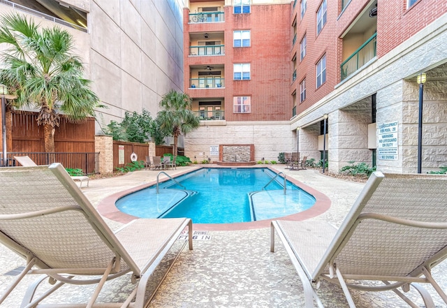 300 St Joseph Pkwy Unit 121, Houston, TX 77002 - community pool with a patio area