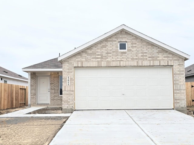 6014 Standpiper Loop, Baytown, TX 77521 - ranch-style house with concrete driveway, a garage, a shingled roof, and brick siding