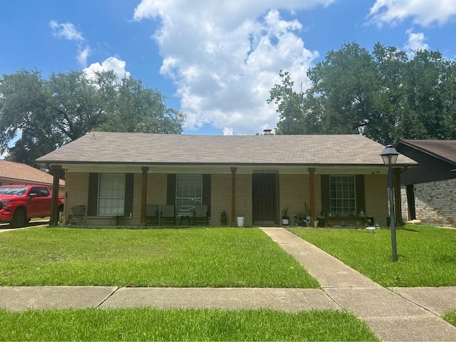 9314 Kristin Dr, Houston, TX 77031 - single story home with a porch, brick siding, and a front lawn