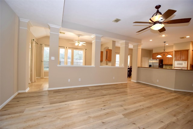3106 Rainbow Ct, Pearland, TX 77584 - unfurnished living room with ceiling fan, decorative columns, light wood finished floors, recessed lighting, and baseboards