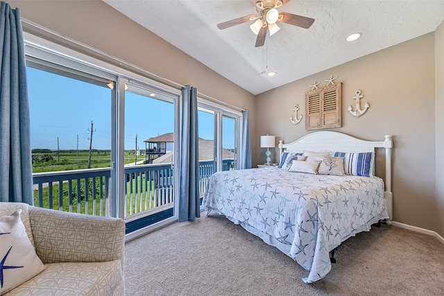 bedroom with carpet flooring, access to outside, lofted ceiling, a ceiling fan, and a textured ceiling