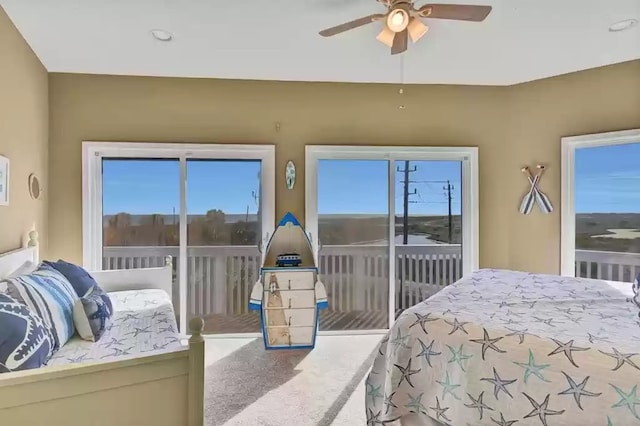bedroom with access to exterior and ceiling fan