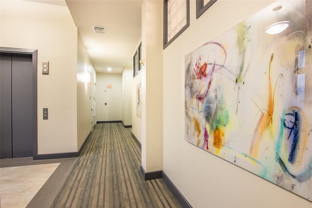 3388 Sage Rd Unit 1702, Houston, TX 77056 - hallway with elevator, carpet floors, and baseboards