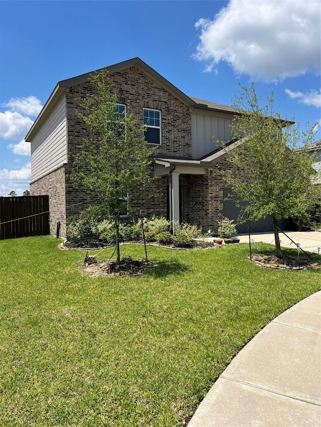 21596 Rolling Streams Dr, New Caney, TX 77357 - view of property exterior with brick siding, driveway, board and batten siding, and a garage