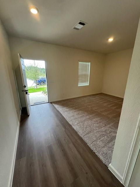 21596 Rolling Streams Dr, New Caney, TX 77357 - empty room featuring dark wood-style floors, baseboards, and recessed lighting