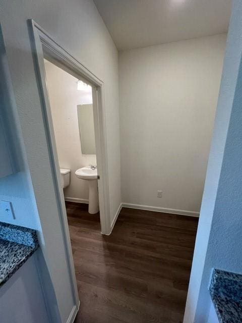 21596 Rolling Streams Dr, New Caney, TX 77357 - bathroom featuring wood finished floors and baseboards