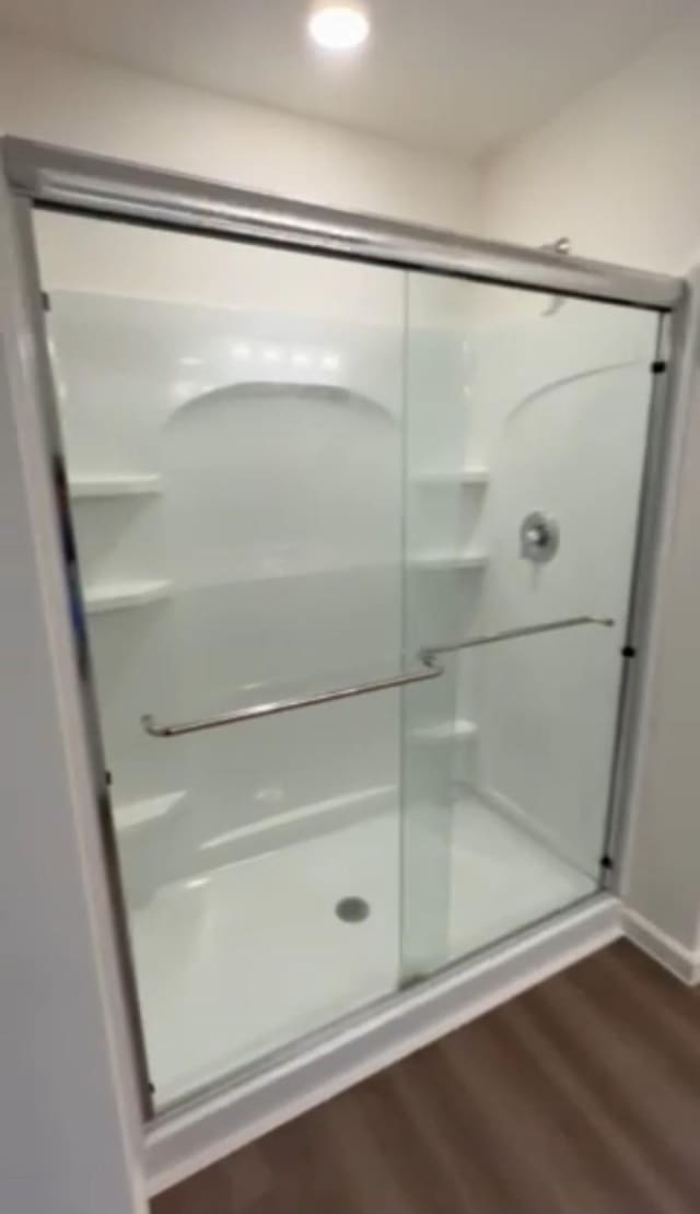 21596 Rolling Streams Dr, New Caney, TX 77357 - bathroom featuring a shower stall, wood finished floors, and recessed lighting