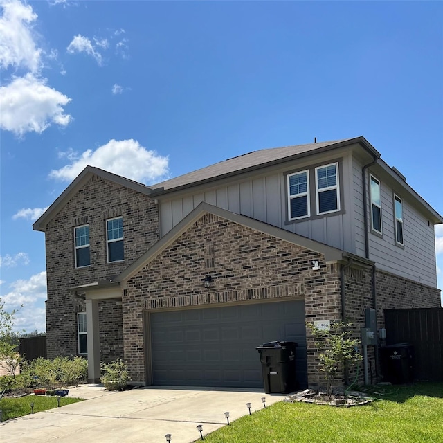21596 Rolling Streams Dr, New Caney, TX 77357 - view of front facade featuring brick siding, board and batten siding, concrete driveway, fence, and an attached garage