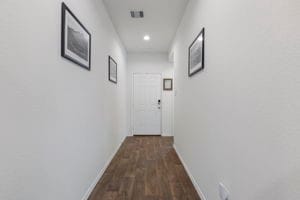 21623 Oakwood Meadows Ln, Katy, TX 77449 - hall featuring baseboards, dark wood-style flooring, and recessed lighting