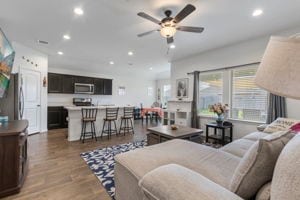 21623 Oakwood Meadows Ln, Katy, TX 77449 - living area featuring recessed lighting, light wood-style floors, and a ceiling fan