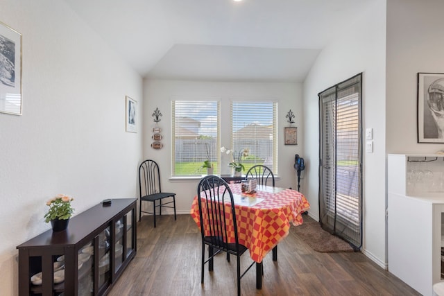 21623 Oakwood Meadows Ln, Katy, TX 77449 - dining room featuring lofted ceiling, dark wood-style flooring, and baseboards