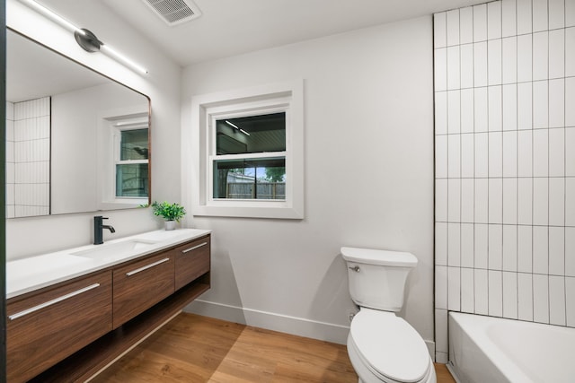 2114 Lazybrook Dr, Houston, TX 77008 - full bath featuring toilet, vanity, wood finished floors, and baseboards