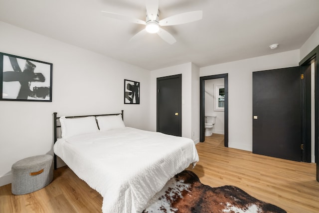 2114 Lazybrook Dr, Houston, TX 77008 - bedroom with light wood-style floors, baseboards, ensuite bathroom, and ceiling fan