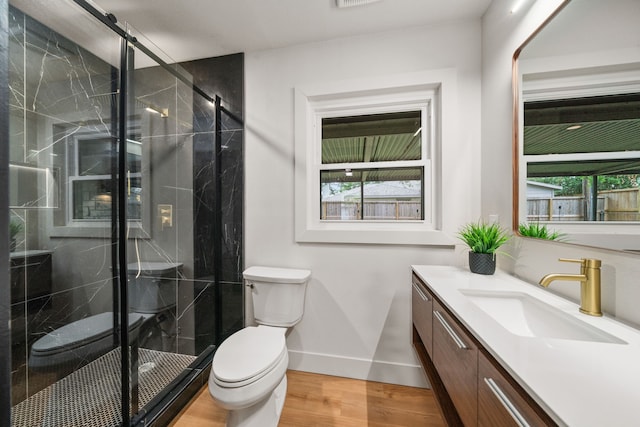 2114 Lazybrook Dr, Houston, TX 77008 - bathroom with toilet, vanity, a marble finish shower, wood finished floors, and baseboards
