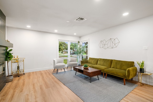 2114 Lazybrook Dr, Houston, TX 77008 - living area with light wood-style floors, recessed lighting, and baseboards