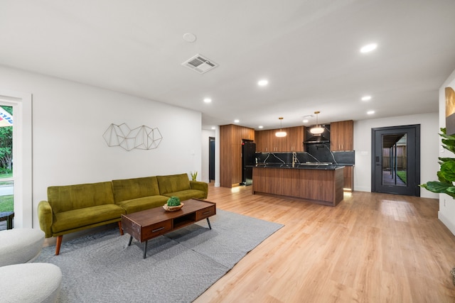 2114 Lazybrook Dr, Houston, TX 77008 - living room featuring recessed lighting and light wood-style flooring