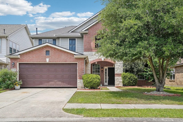 3339 Legends Creek Dr, Spring, TX 77386 - view of front facade with an attached garage, driveway, stone siding, a front yard, and brick siding