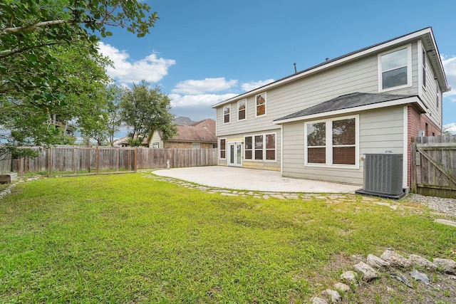 3339 Legends Creek Dr, Spring, TX 77386 - back of property with central AC unit and a patio area