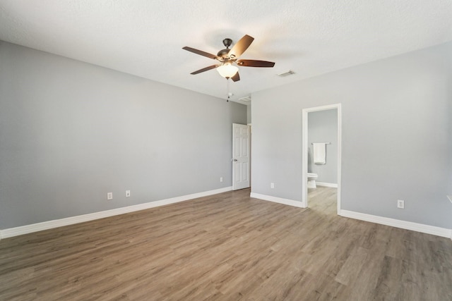 3339 Legends Creek Dr, Spring, TX 77386 - empty room featuring wood finished floors, ceiling fan, and baseboards
