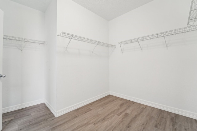 3339 Legends Creek Dr, Spring, TX 77386 - spacious closet with wood finished floors