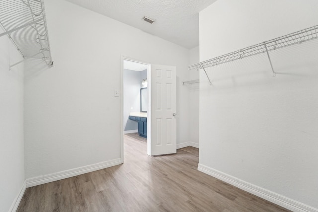 3339 Legends Creek Dr, Spring, TX 77386 - walk in closet with wood finished floors