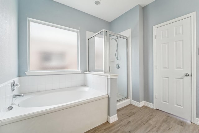 3339 Legends Creek Dr, Spring, TX 77386 - full bathroom with a stall shower, wood finished floors, and a bath