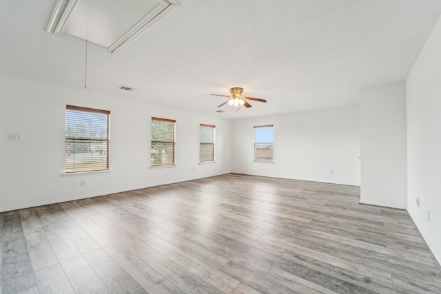 3339 Legends Creek Dr, Spring, TX 77386 - empty room with attic access, healthy amount of natural light, and wood finished floors