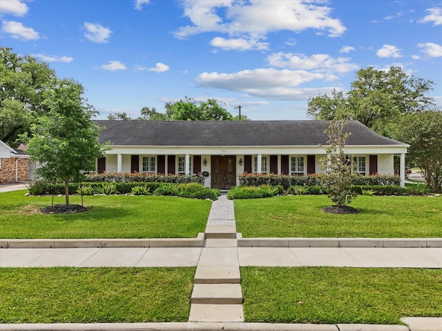 7723 Meadowbriar Ln, Houston, TX 77063 - ranch-style house with a front lawn and brick siding