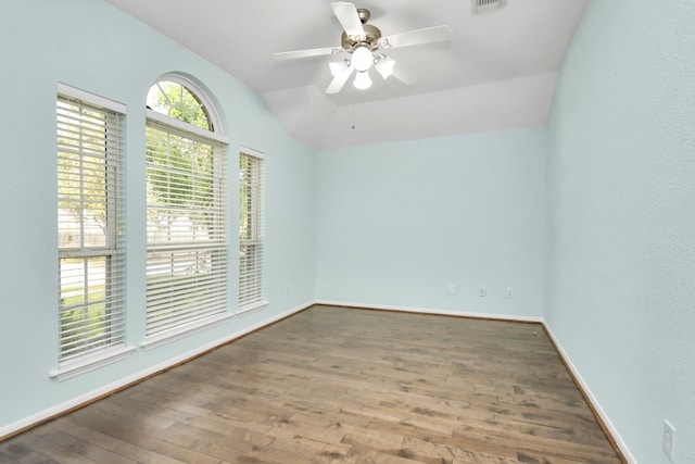 6007 Indian Crk, Missouri City, TX 77459 - spare room with wood finished floors, baseboards, vaulted ceiling, and a ceiling fan
