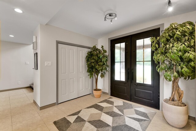 19727 Country Lake Dr, Magnolia, TX 77355 - entrance foyer with light tile patterned flooring, baseboards, and recessed lighting
