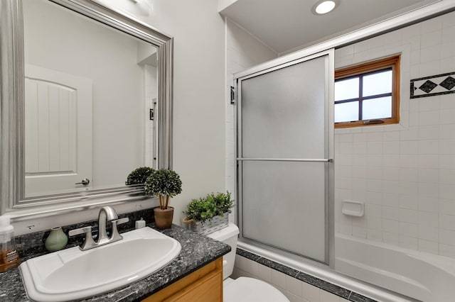19727 Country Lake Dr, Magnolia, TX 77355 - bathroom featuring vanity, toilet, and shower / bath combination with glass door