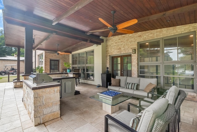 19727 Country Lake Dr, Magnolia, TX 77355 - view of patio with ceiling fan, an outdoor living space with a fire pit, and a sink