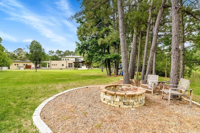 19727 Country Lake Dr, Magnolia, TX 77355 - view of green lawn featuring a fire pit