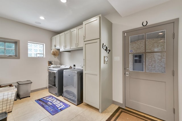 19727 Country Lake Dr, Magnolia, TX 77355 - laundry area with washing machine and clothes dryer, cabinet space, light tile patterned flooring, and recessed lighting