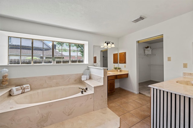 10255 Crooks Way Ct, Houston, TX 77065 - full bath with tile patterned flooring, vanity, a bath, a spacious closet, and baseboards