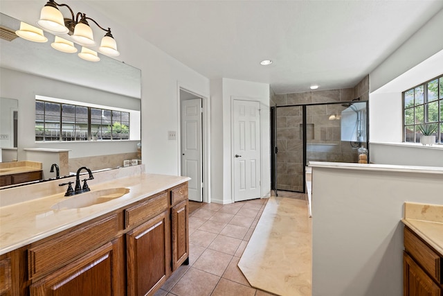 10255 Crooks Way Ct, Houston, TX 77065 - bathroom with tiled shower, vanity, tile patterned flooring, recessed lighting, and baseboards