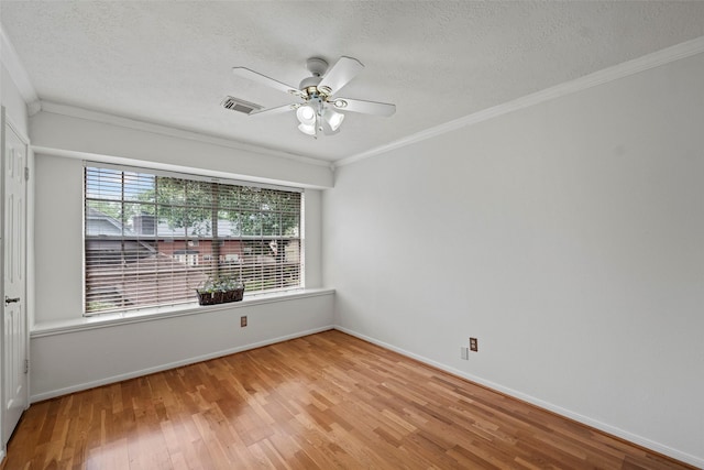 10255 Crooks Way Ct, Houston, TX 77065 - empty room with a textured ceiling, light wood-style flooring, ceiling fan, crown molding, and baseboards