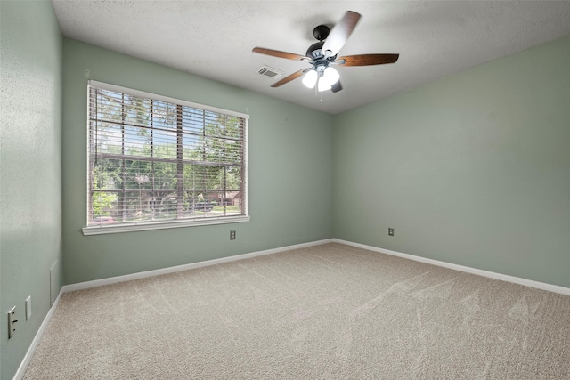 10255 Crooks Way Ct, Houston, TX 77065 - unfurnished room featuring carpet flooring, a ceiling fan, baseboards, and a textured ceiling